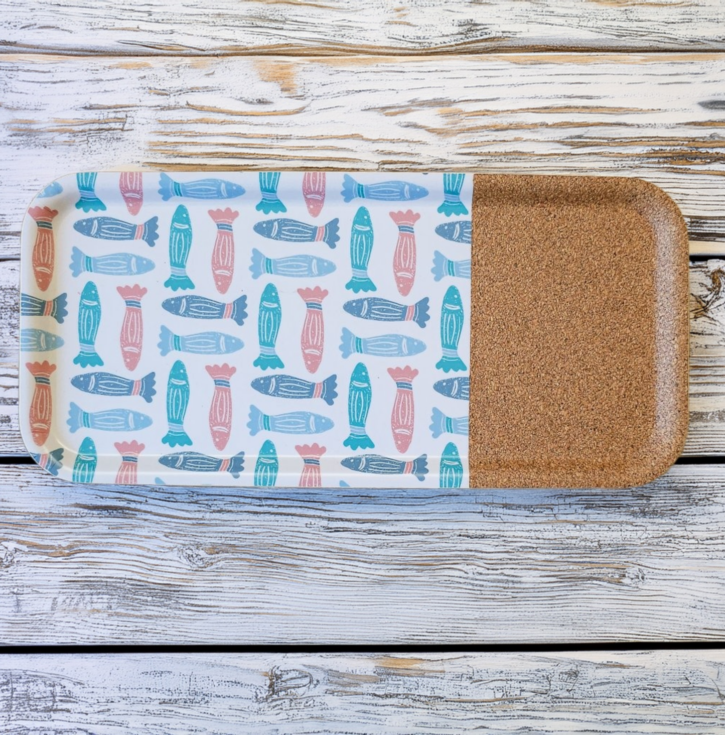 ZIA LIVING rectangular serving tray featuring a colourful fish pattern with a natural cork section, displayed on a whitewashed wooden surface.